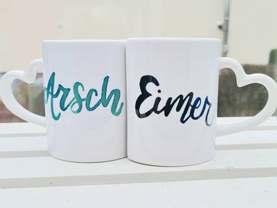 Partnertasse „Arsch und Eimer“ – Das perfekte Duo für verliebte Paare
