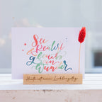 Postkarte mit Lettering "Sei Realist"